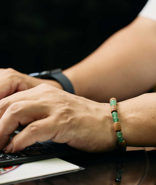 Sandalwood bracelet engraved with the Heart Sutra and accented with a jade bead—handcrafted for spiritual protection and harmony. Handcrafted in Kyoto Japan Kanbe Juzu