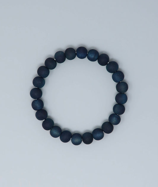 Women's indigo pearl bracelet made from mountain cherry wood, handcrafted in Japan using traditional Sho-Aizome indigo dyeing by Kanbe Juzu of Kyoto; spiritual accessory inspired by samurai, ideal for yoga, prayer, or as a premium gift.