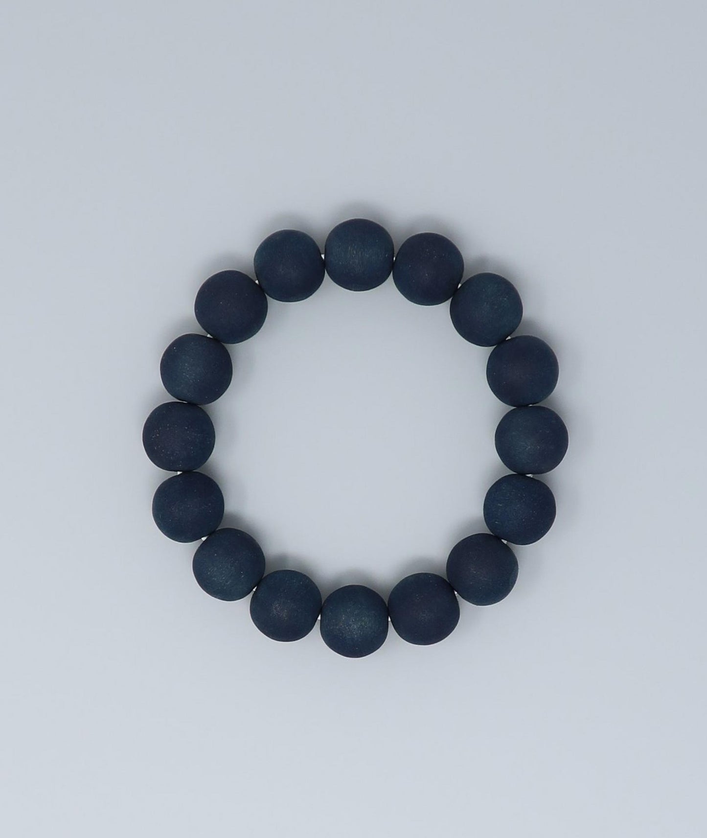 Men's indigo pearl bracelet made from mountain cherry wood, handcrafted in Japan using traditional Sho-Aizome indigo dyeing by Kanbe Juzu of Kyoto; spiritual accessory inspired by samurai, ideal for yoga, prayer, or as a premium gift.