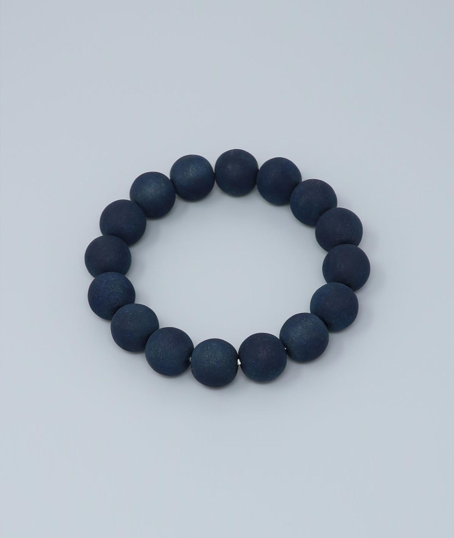 Men's indigo pearl bracelet made from mountain cherry wood, handcrafted in Japan using traditional Sho-Aizome indigo dyeing by Kanbe Juzu of Kyoto; spiritual accessory inspired by samurai, ideal for yoga, prayer, or as a premium gift.