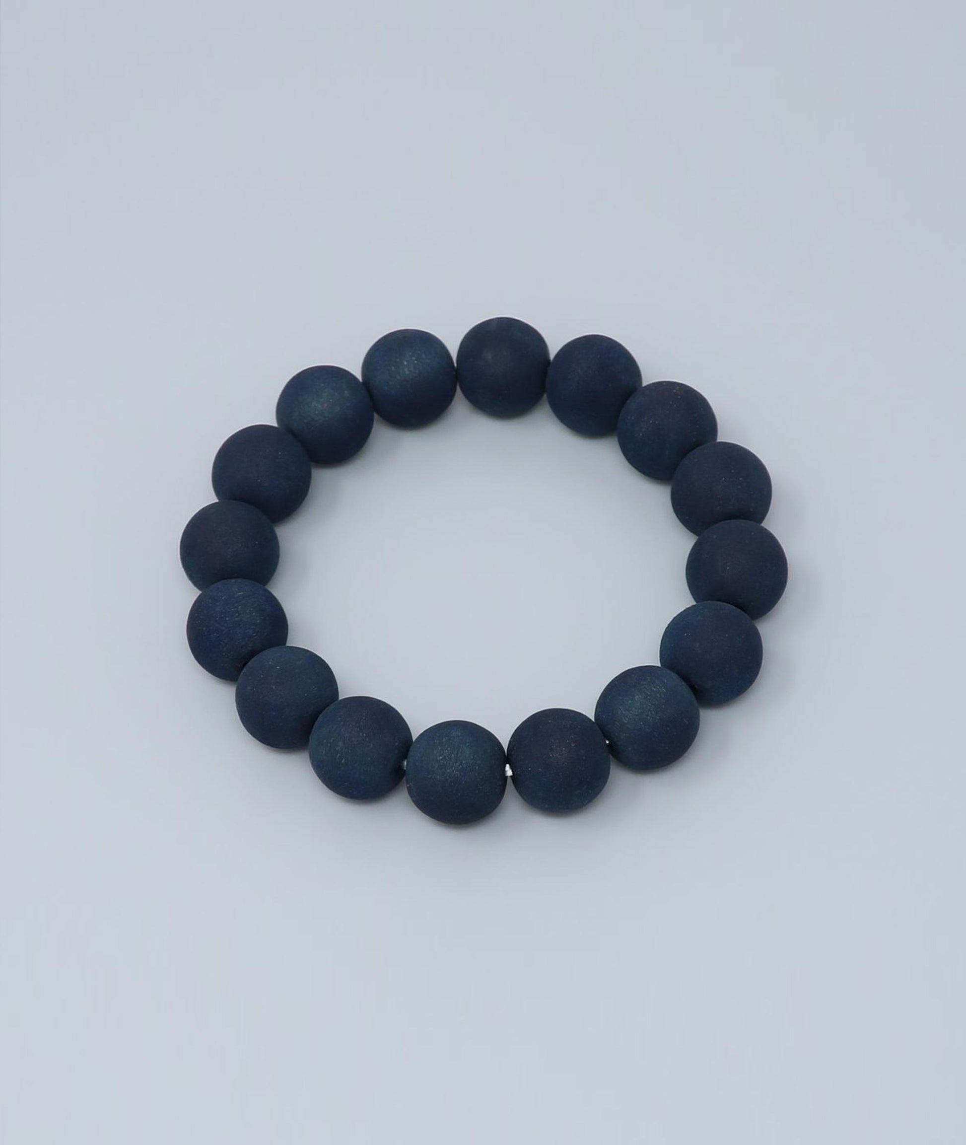 Men's indigo pearl bracelet made from mountain cherry wood, handcrafted in Japan using traditional Sho-Aizome indigo dyeing by Kanbe Juzu of Kyoto; spiritual accessory inspired by samurai, ideal for yoga, prayer, or as a premium gift.