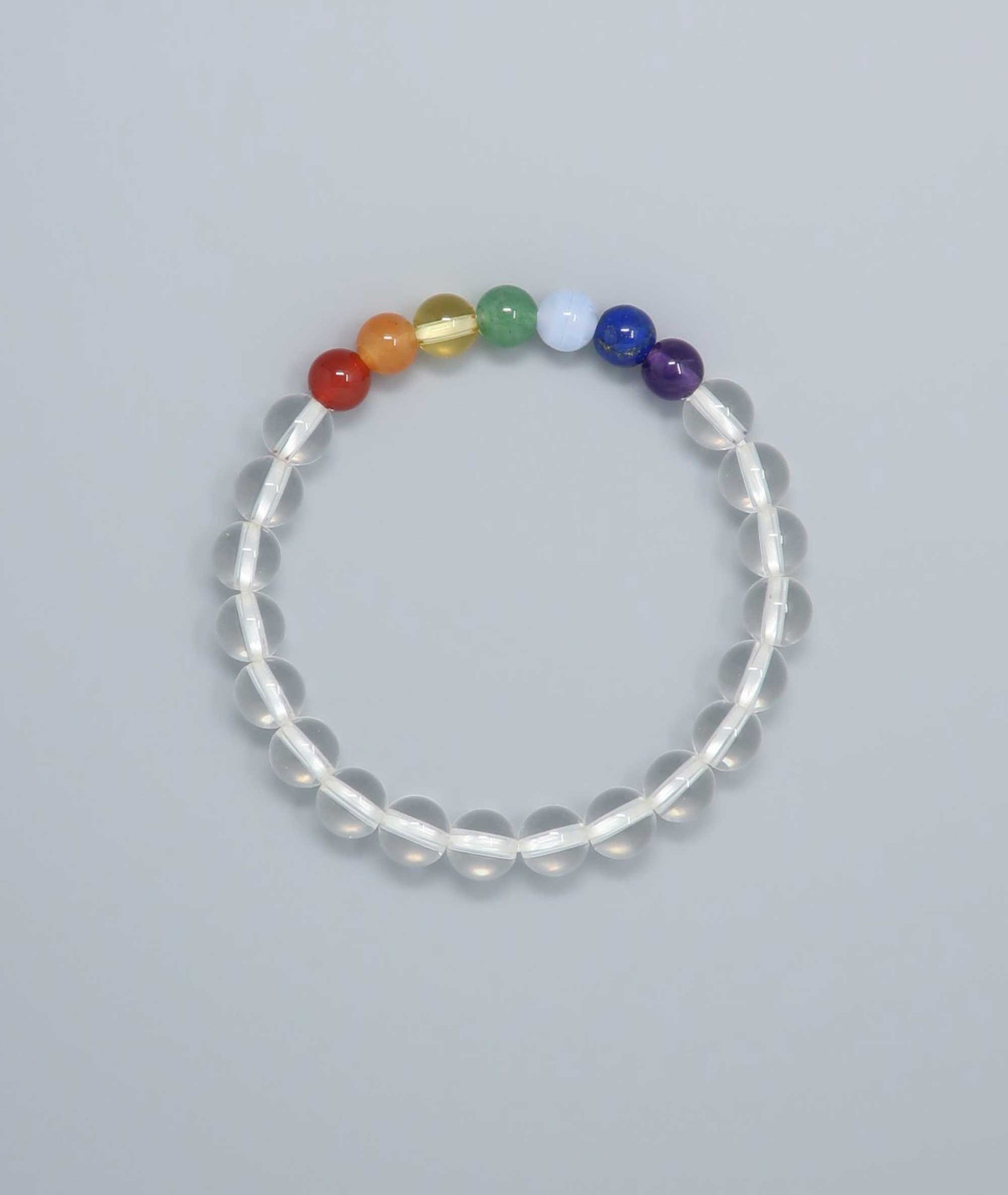 Handcrafted bracelet featuring Japanese clear quartz and seven-colored gemstones representing protection and good fortune. Handcrafted in Japan Kanbe Juzu, ideal for amulet, yoga, meditation, prayer, or gifting.