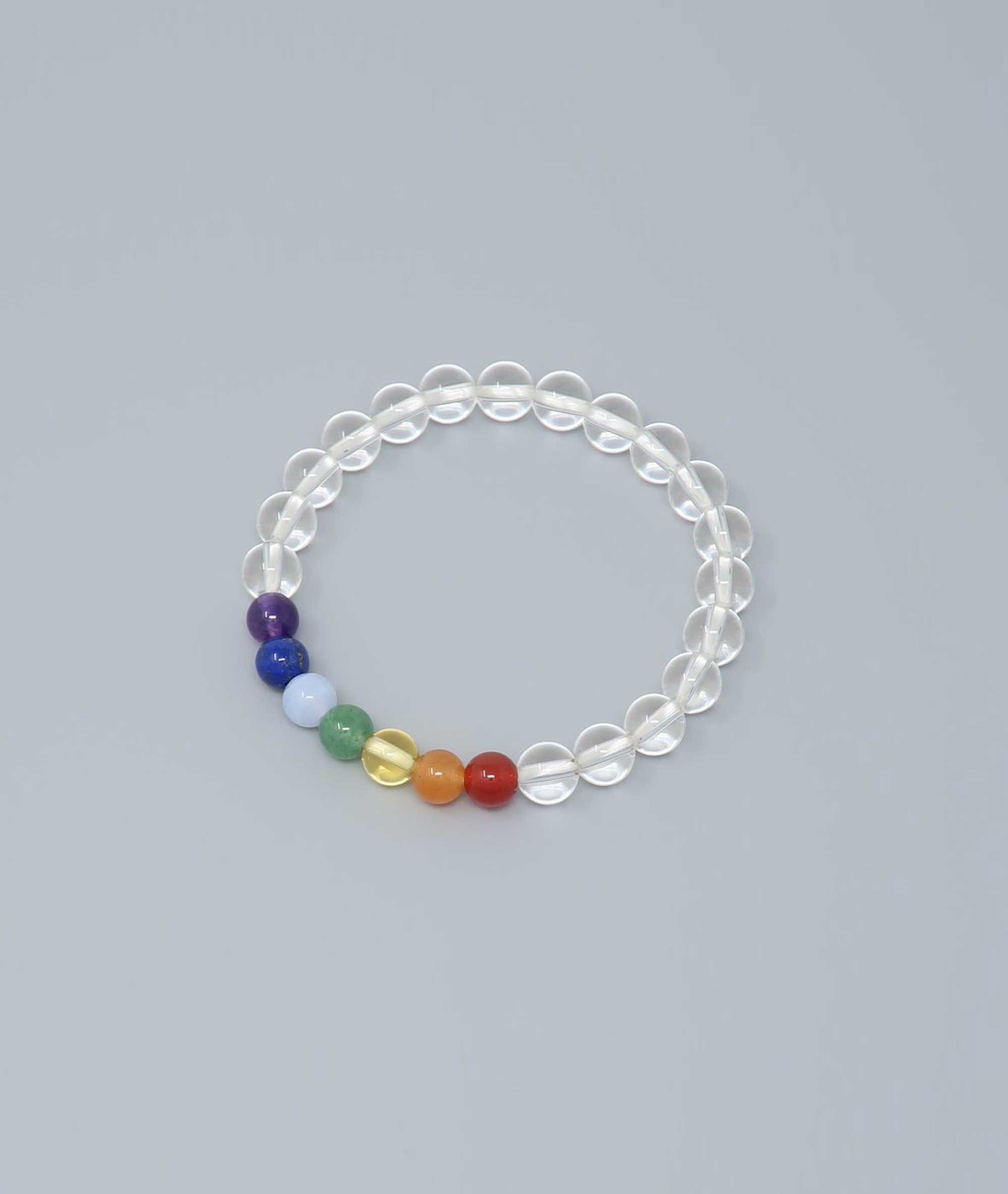 Handcrafted bracelet featuring Japanese clear quartz and seven-colored gemstones representing protection and good fortune. Handcrafted in Japan Kanbe Juzu, ideal for amulet, yoga, meditation, prayer, or gifting.