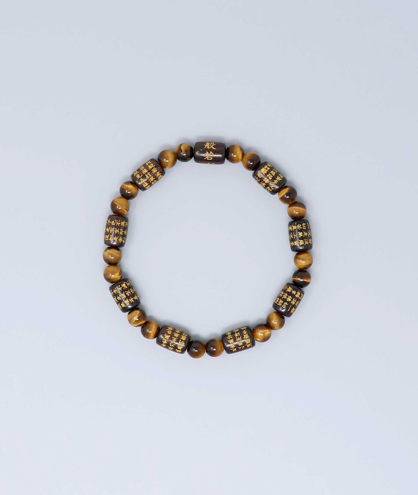 Striped ebony bracelet with Heart Sutra engraving and Tiger’s Eye beads, handmade for spiritual protection and strength. Handcrafted in Kyoto Japan Kanbe Juzu