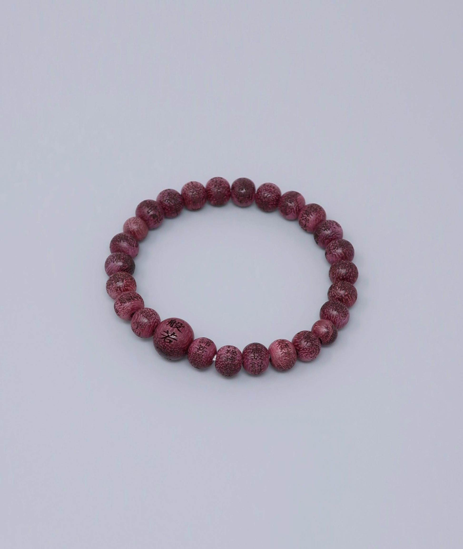 Unisex Buddhist prayer bracelet made from Purpleheart wood, engraved with the full Heart Sutra – a handmade spiritual mala for meditation, protection, and mindfulness. Handcrafted in Japan Kanbe Juzu, ideal for amulet, yoga, meditation, prayer, or gifting.