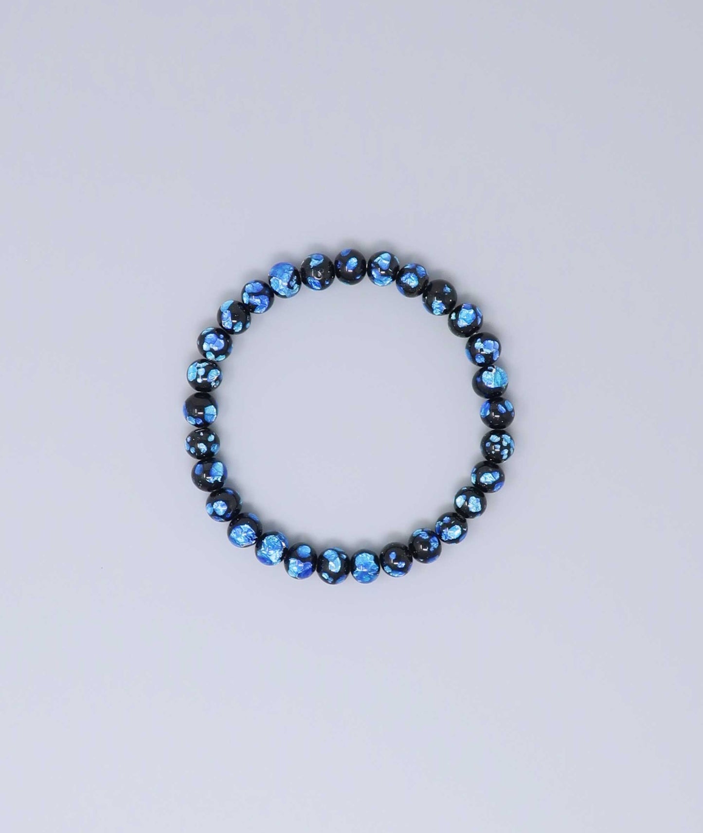Elegant Blue Ryukyu fluorite bracelet with shimmering light blue accents on a jet-black base. Handmade by artisans, combining mystique and luxury. Handcrafted in Japan Kanbe Juzu, ideal for amulet, yoga, meditation, prayer, or gifting.