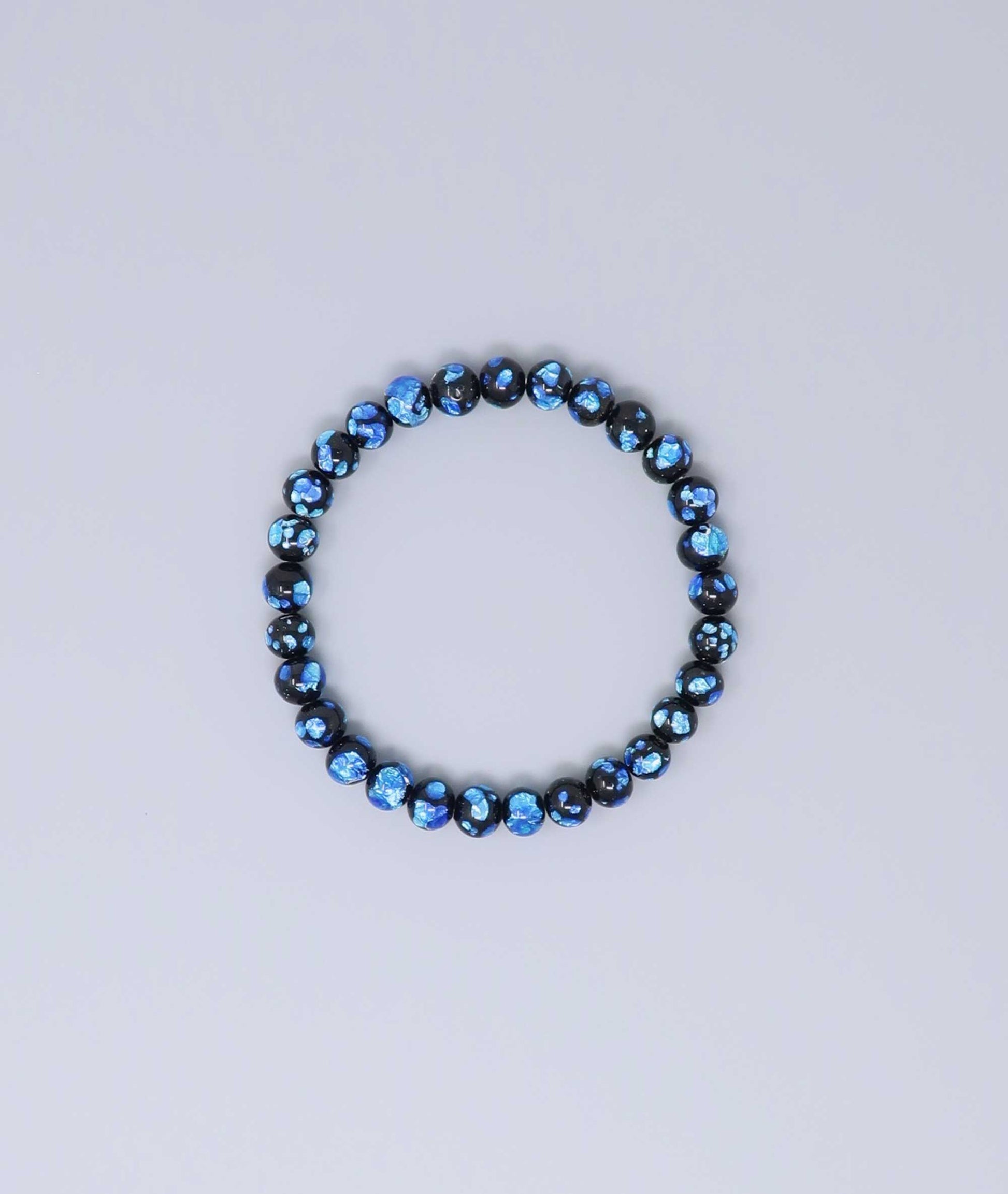Elegant Blue Ryukyu fluorite bracelet with shimmering light blue accents on a jet-black base. Handmade by artisans, combining mystique and luxury. Handcrafted in Japan Kanbe Juzu, ideal for amulet, yoga, meditation, prayer, or gifting.