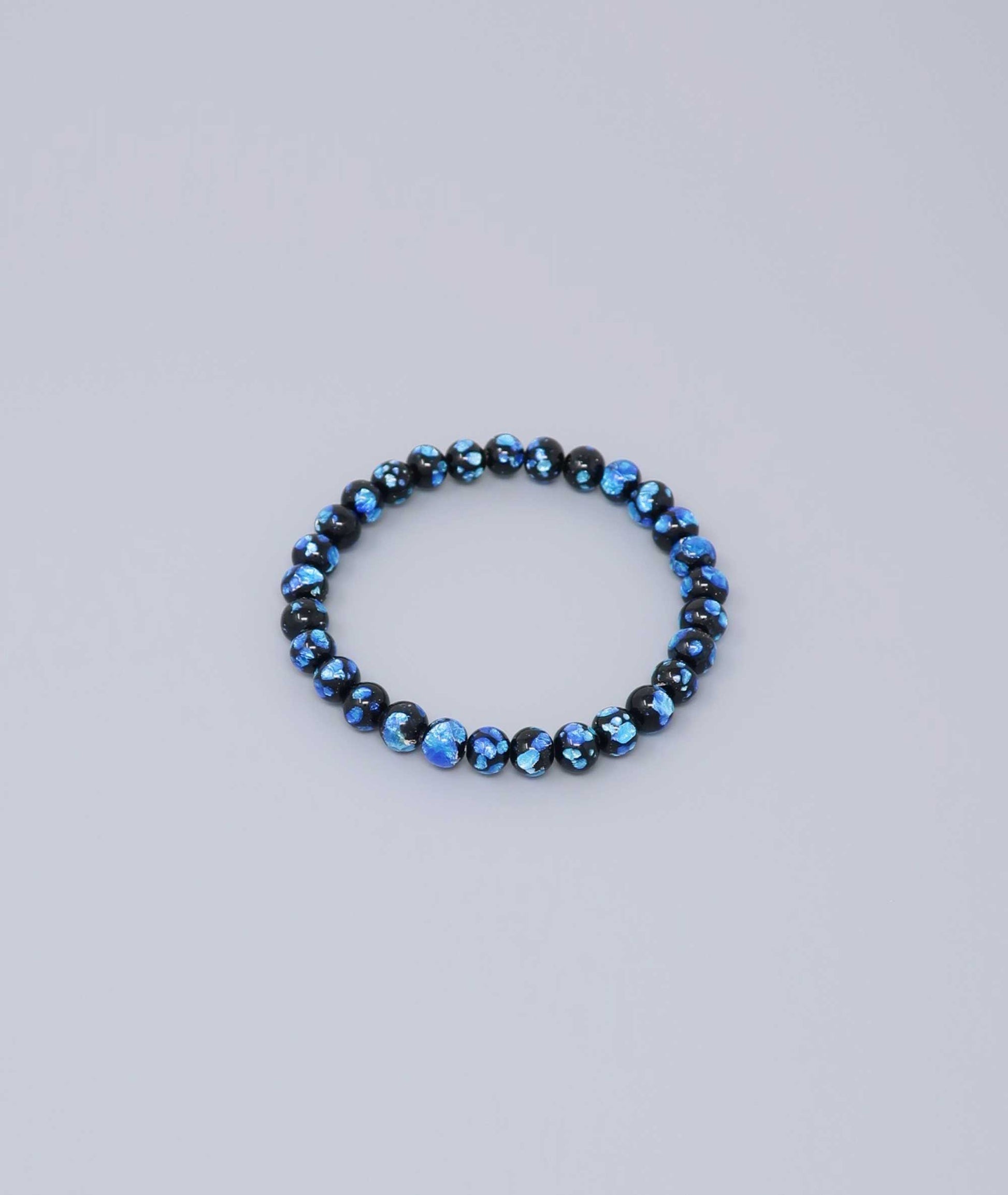 Elegant Blue Ryukyu fluorite bracelet with shimmering light blue accents on a jet-black base. Handmade by artisans, combining mystique and luxury. Handcrafted in Japan Kanbe Juzu, ideal for amulet, yoga, meditation, prayer, or gifting.