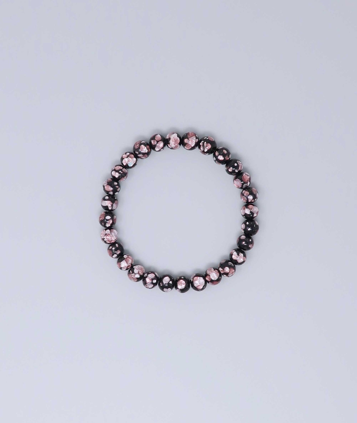 Elegant pink Ryukyu fluorite bracelet with shimmering light pink accents on a jet-black base. Handmade by artisans, combining mystique and luxury. Handcrafted in Japan Kanbe Juzu, ideal for amulet, yoga, meditation, prayer, or gifting.
